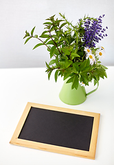 Image showing bunch of herbs and flowers with chalkboard