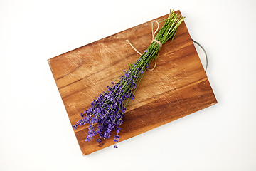 Image showing bunch of lavender flowers on wooden board