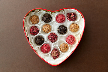 Image showing candies in red heart shaped chocolate box