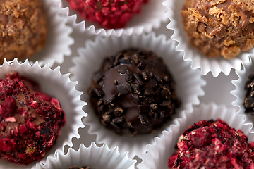 Image showing close up of different candies in paper cups