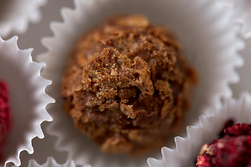 Image showing close up of different candies in paper cups