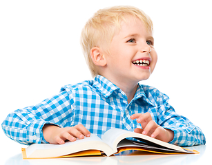 Image showing Little child play with book