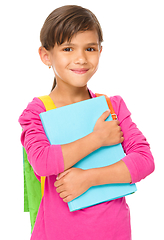 Image showing Young girl is holding book