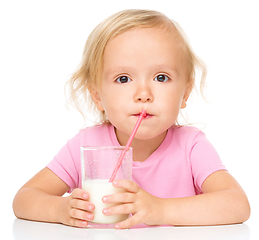 Image showing Cute little girl with a glass of milk