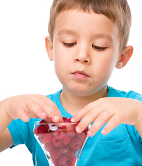 Image showing Little boy with raspberries