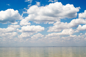 Image showing The blue sky and clouds over a bay