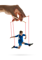 Image showing Boy like a puppet in somebodies hands. Concept of manipulation