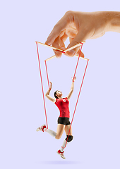 Image showing Woman like a puppet in somebodies hands. Concept of manipulation