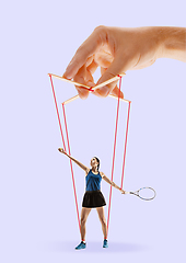 Image showing Woman like a puppet in somebodies hands. Concept of manipulation