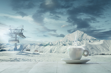 Image showing Single tea or coffee mug and landscape of mountains on background