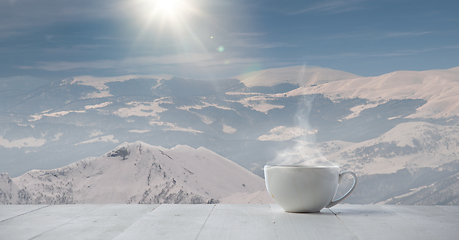 Image showing Single tea or coffee mug and landscape of mountains on background