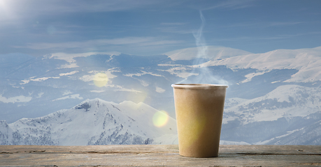 Image showing Single tea or coffee mug and landscape of mountains on background