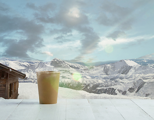 Image showing Single tea or coffee mug and landscape of mountains on background