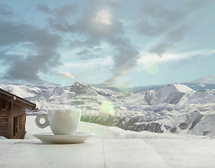 Image showing Single tea or coffee mug and landscape of mountains on background