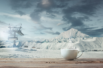 Image showing Single tea or coffee mug and landscape of mountains on background