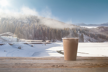 Image showing Single tea or coffee mug and landscape of mountains on background