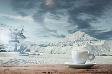 Image showing Single tea or coffee mug and landscape of mountains on background