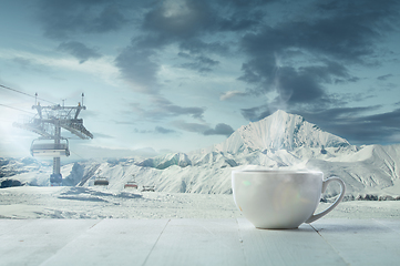 Image showing Single tea or coffee mug and landscape of mountains on background