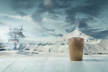 Image showing Single tea or coffee mug and landscape of mountains on background