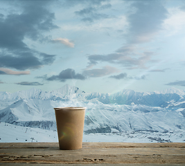 Image showing Single tea aor coffee mug and landscape of mountains on background