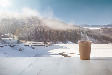 Image showing Single tea or coffee mug and landscape of mountains on background