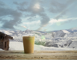 Image showing Single tea or coffee mug and landscape of mountains on background