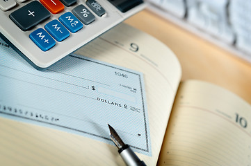 Image showing Money check and calculator