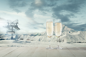 Image showing Champagne in glasses and landscape of mountains on background