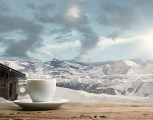 Image showing Single tea or coffee mug and landscape of mountains on background