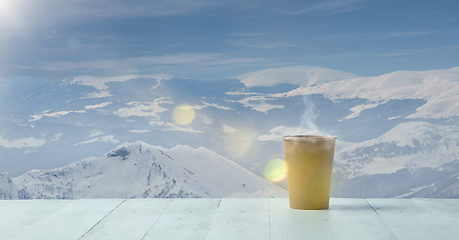 Image showing Single tea or coffee mug and landscape of mountains on background