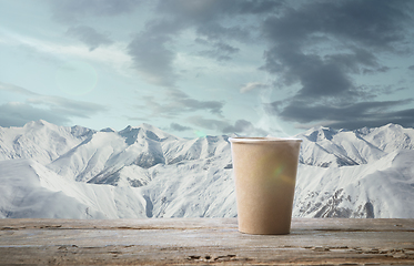 Image showing Single tea or coffee mug and landscape of mountains on background