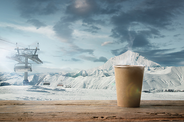 Image showing Single tea or coffee mug and landscape of mountains on background