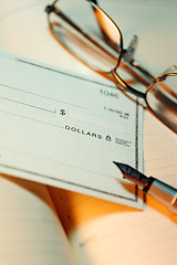Image showing Money check and glasses