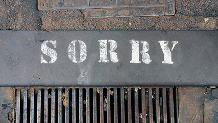 Image showing word sorry at the street