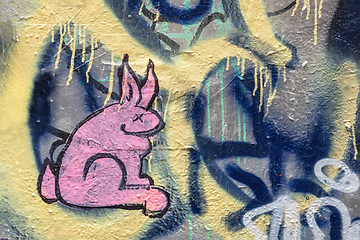 Image showing pink graffiti rabbit painting on a wall