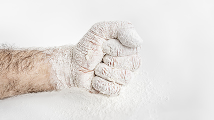 Image showing male fist covered in flour