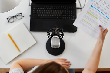 Image showing woman with microphone recording podcast at studio