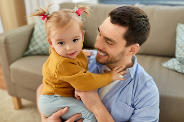 Image showing father with little baby daughter at home