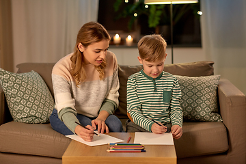 Image showing mother and son with pencils drawing at home