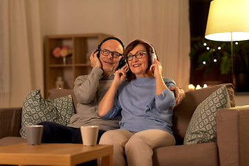 Image showing senior couple with headphones listening to music
