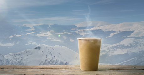 Image showing Single tea or coffee mug and landscape of mountains on background