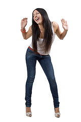 Image showing The happy beautiful young woman in jeans. Isolated