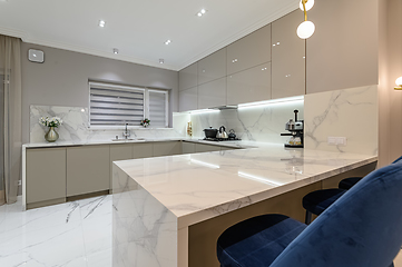 Image showing Luxury white modern marble kitchen in studio space