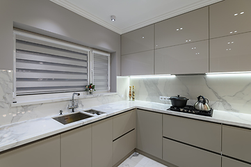 Image showing Luxury white modern marble kitchen in studio space