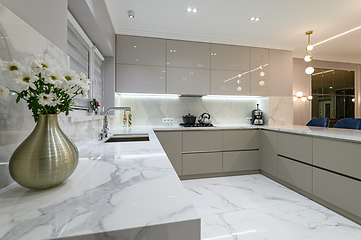 Image showing closeup to white modern marble kitchen furniture in studio space