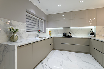 Image showing Luxury white modern marble kitchen in studio space