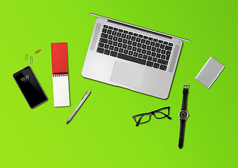 Image showing Office desk mockup top view isolated on green