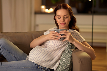 Image showing pregnant woman drinking tea at home