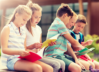 Image showing group of happy elementary school students outdoors