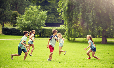 Image showing happy kids running and playing game outdoors